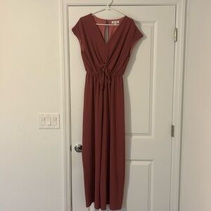 A deep salmon long pants romper